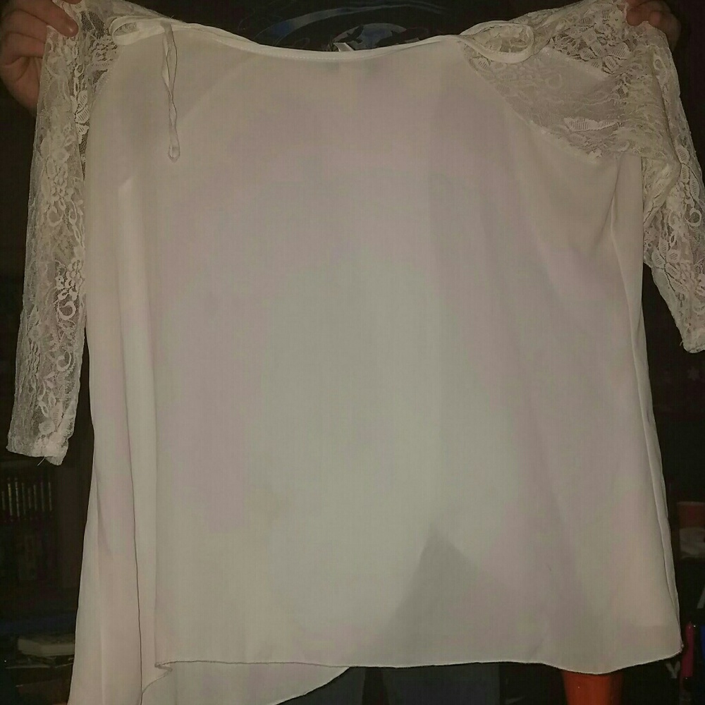deb
White Lace arms and split back very cute